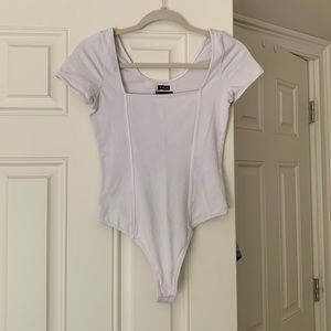 White shirt sleeve UO thong body suit.